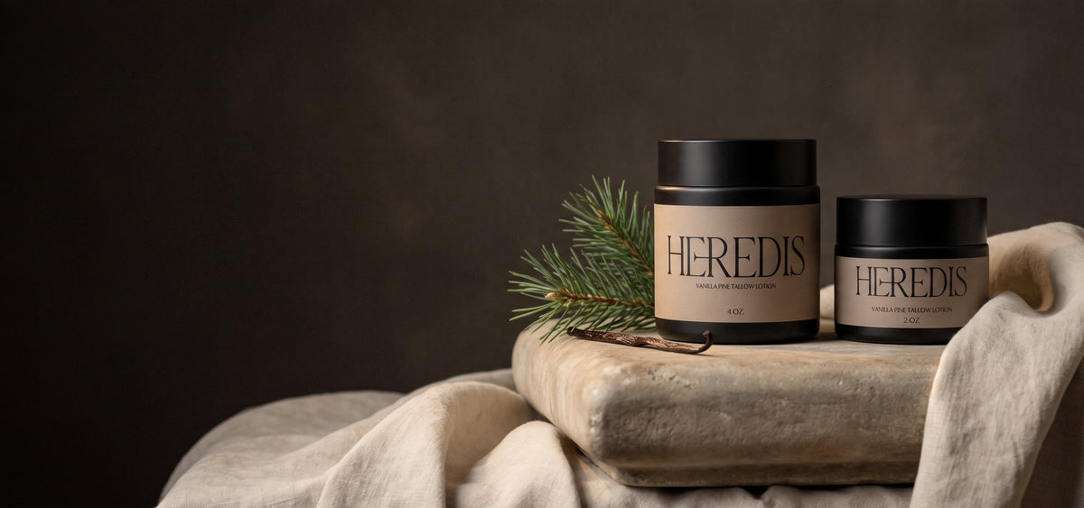 Heredis Vanilla Pine Tallow Lotion jars on a limestone plinth with linen, pine and vanilla1621243260e1af0c20-2